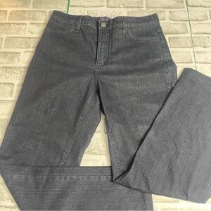 NYDJ Women’s Dark blue jeans. Stoned pockets. Size 10. Hemmed. Preowned.